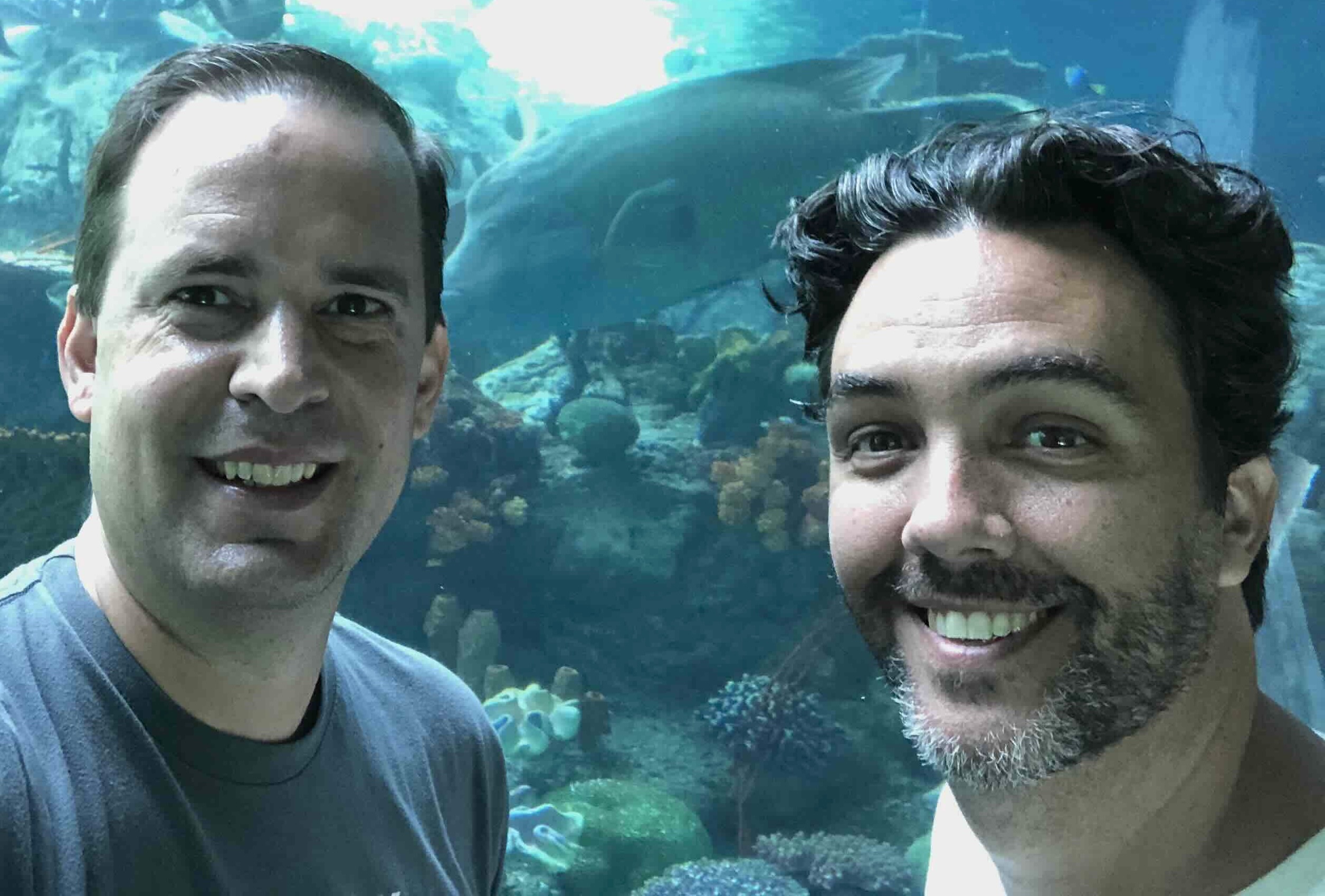 Tom and Michael in front of an aquarium